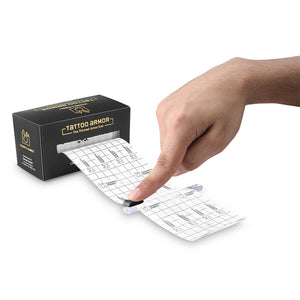 Tattoo armor packaging with a hand holding a sheet of temporary tattoos on a white background