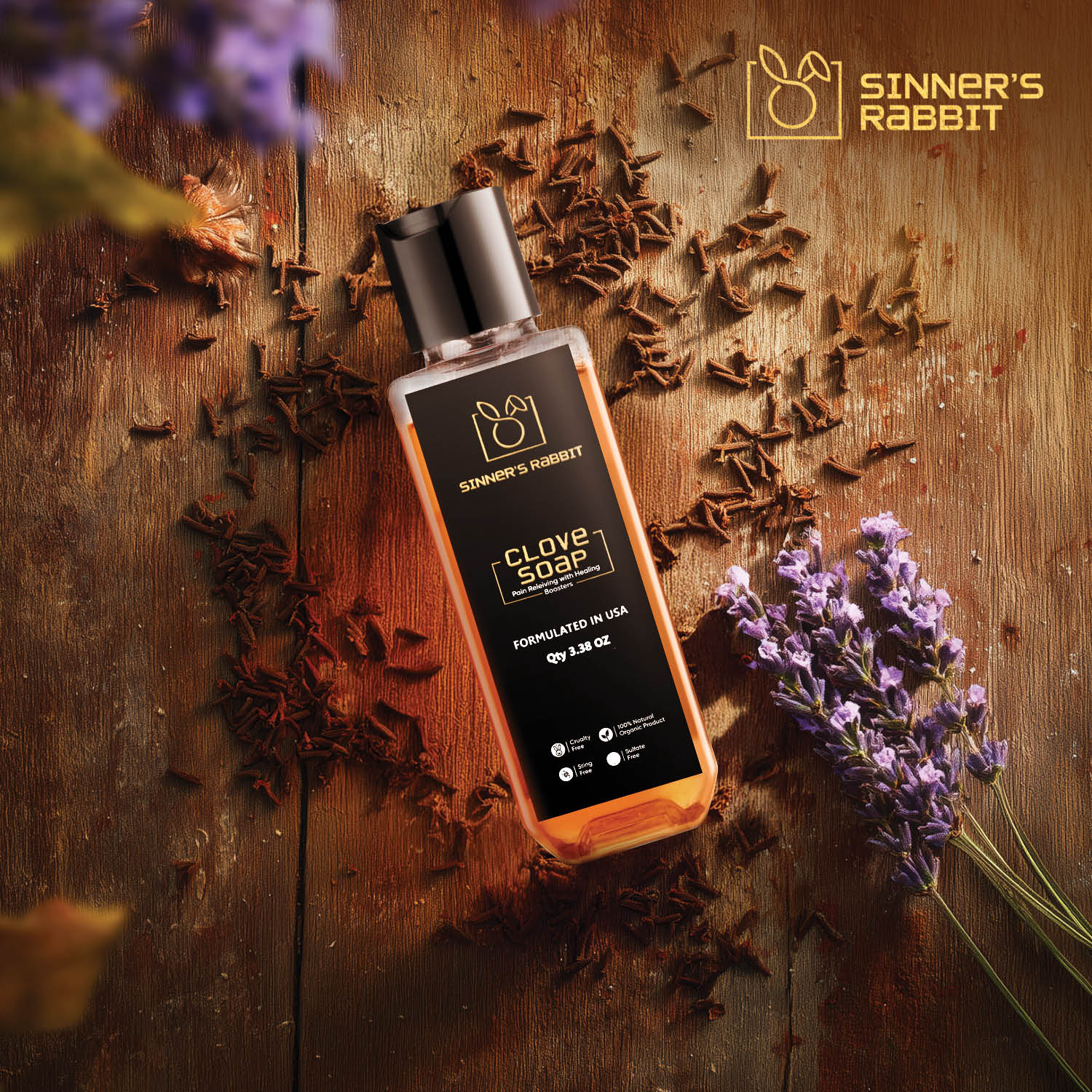 Bottle of Concentrated Clove Soap in 3.38oz on a wooden surface with clove and flower