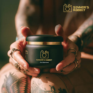 Person holding a jar of Jar Tattoo Vitamins Processing and Healing Ointment in 8oz
